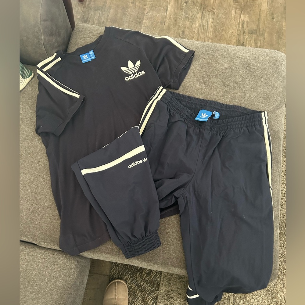 Navy blue adidas track suit